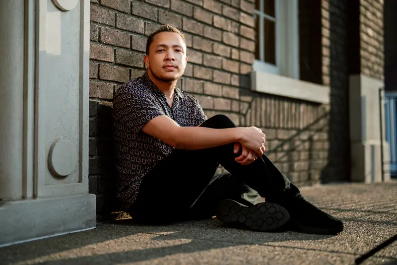 Strong editorial senior portrait with bold framing