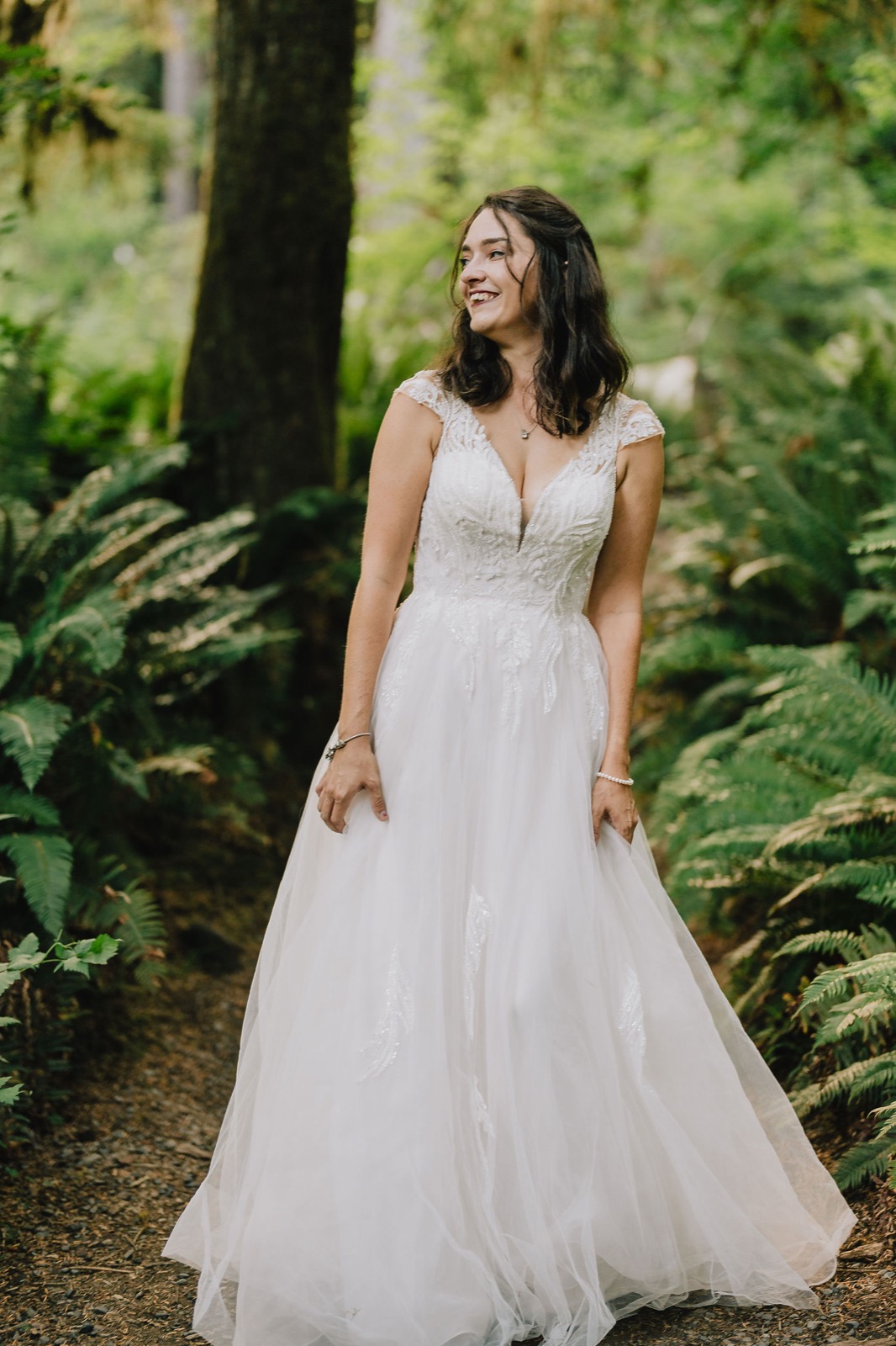Portrait of the bride in the Hoh Rainforest during her Pacific Northwest adventure elopement