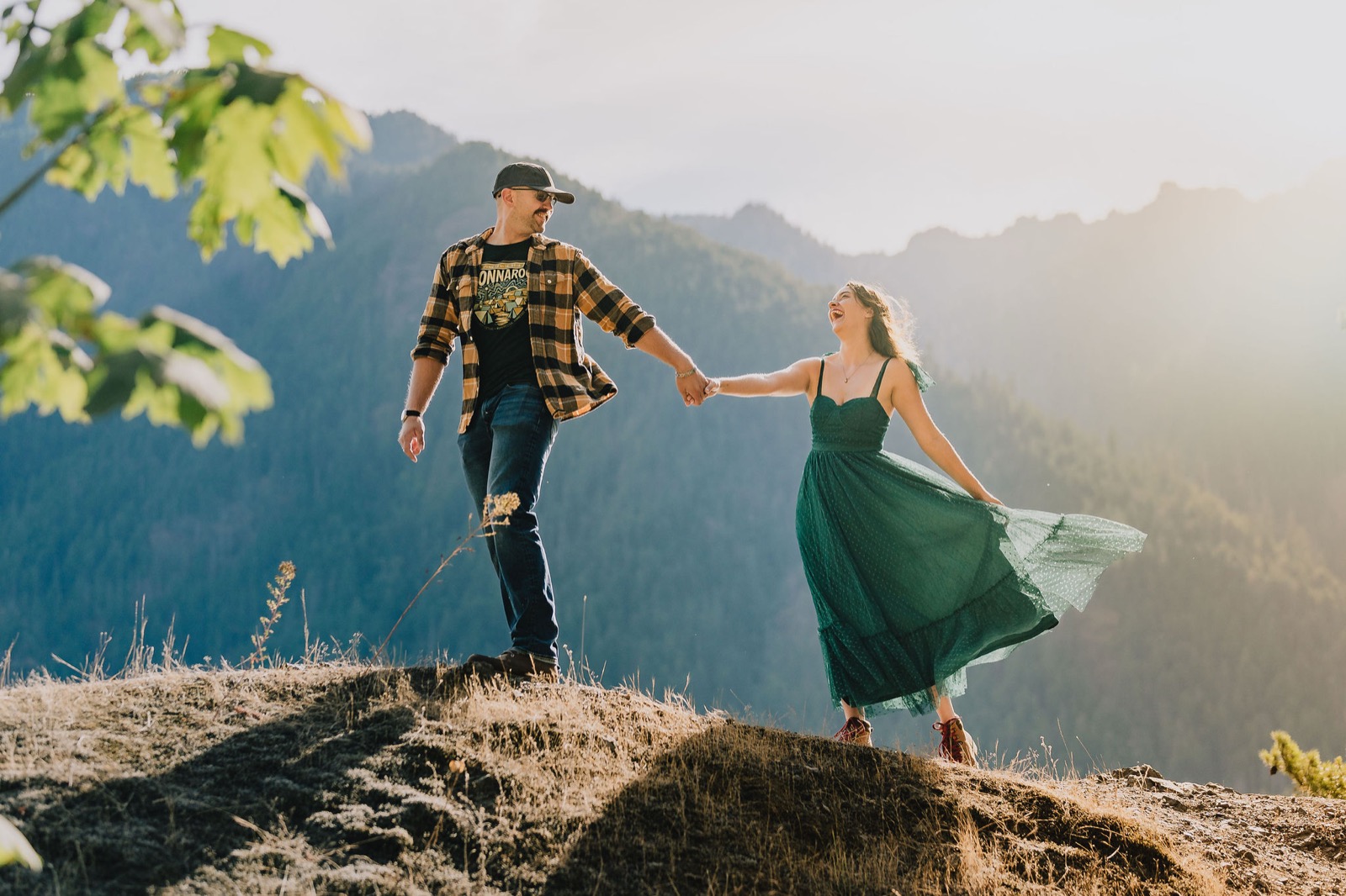 Adriana and Mitchell on a rock overlook above Lake Crescent in Olympic National Park the morning after their elopement